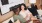 A man and a woman sitting on a couch together