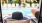 Close-up of a sun hat between two lounge chairs at a pool