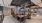 large room with a table and chairs next to a resident kitchen area