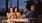 A group of people sitting at a round table with drinks
