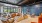 clubroom with tables, chairs, and large windows