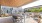 large deck with tables, chairs and plants