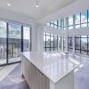 kitchen island overlooking floor to ceiling windows