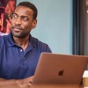 Man working on Laptop in Conference Room