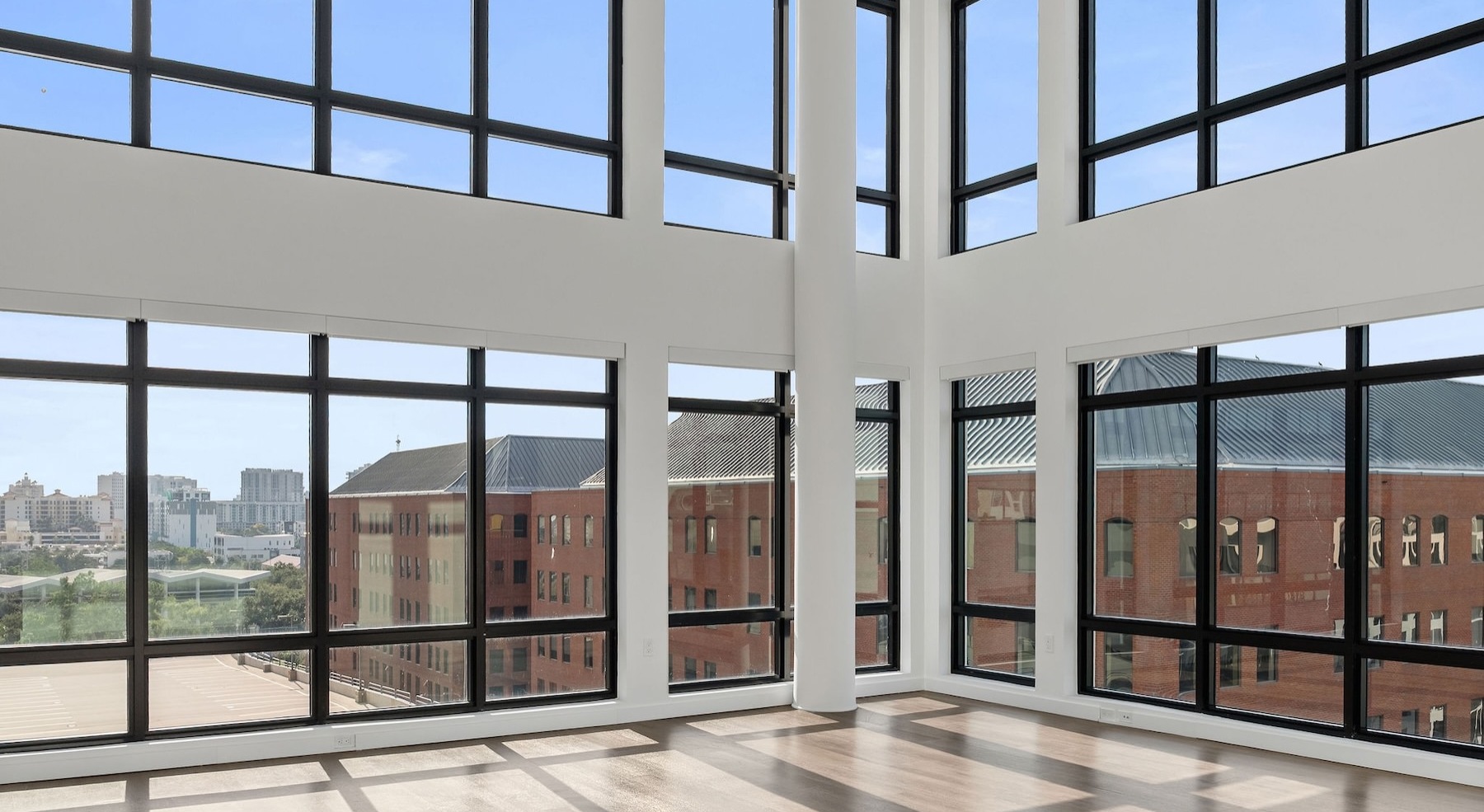 a living room with large windows