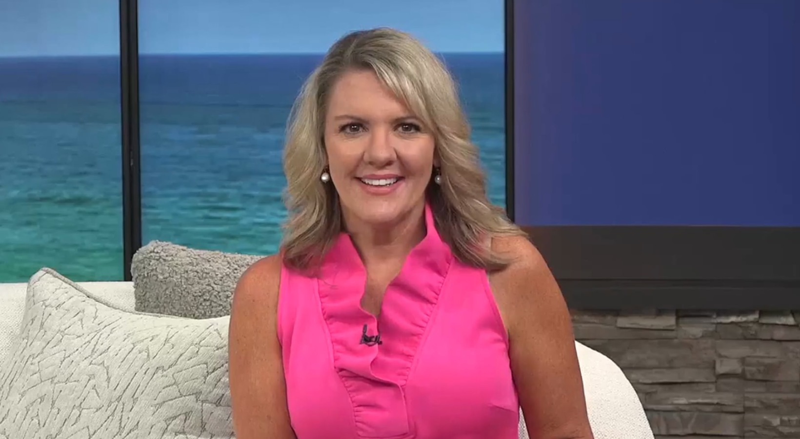 Links News Segment a woman sitting down on a chair smiling