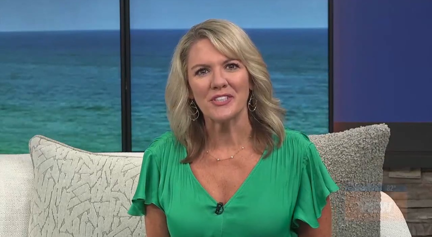 Aster News Segment a woman sitting down on a chair smiling